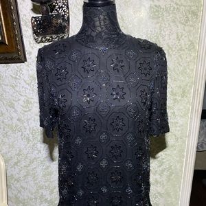 Glittering sequins completely cover  top